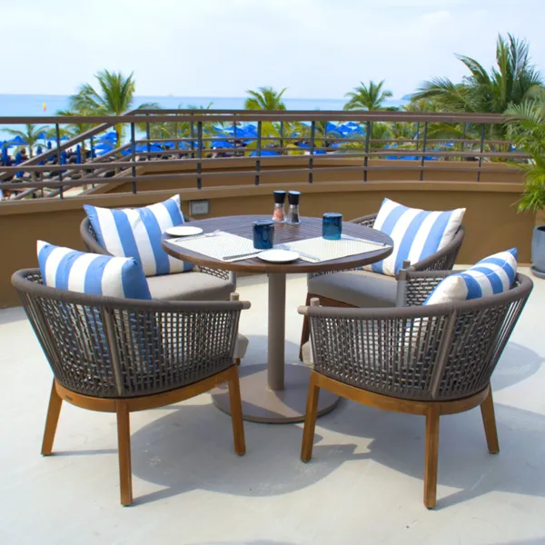 Beachfront outdoor dining furniture at Azura Restaurant, Angsana Laguna Phuket overlooking the Andaman Sea